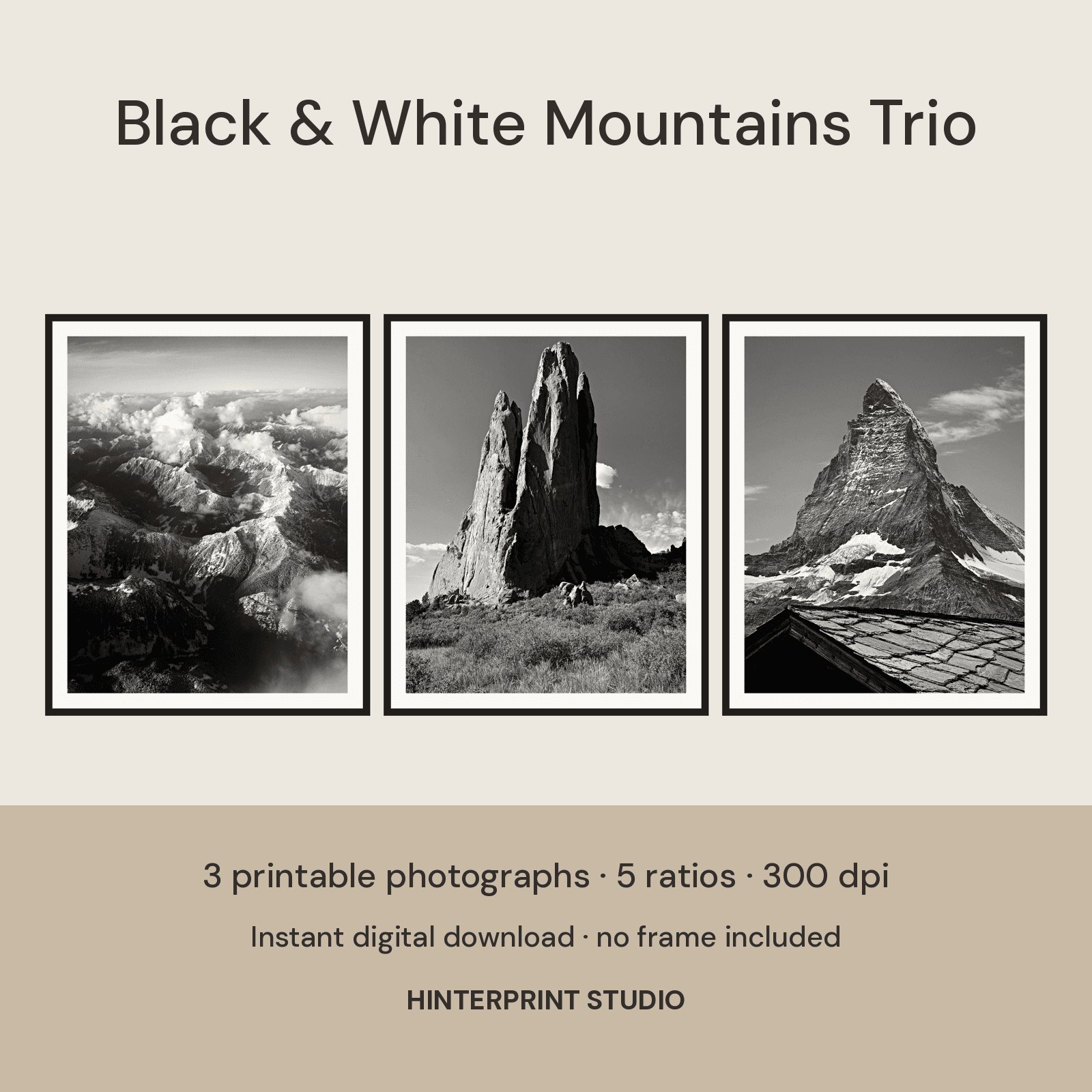 Three framed black-and-white photographs of mountain peaks and clouds.
